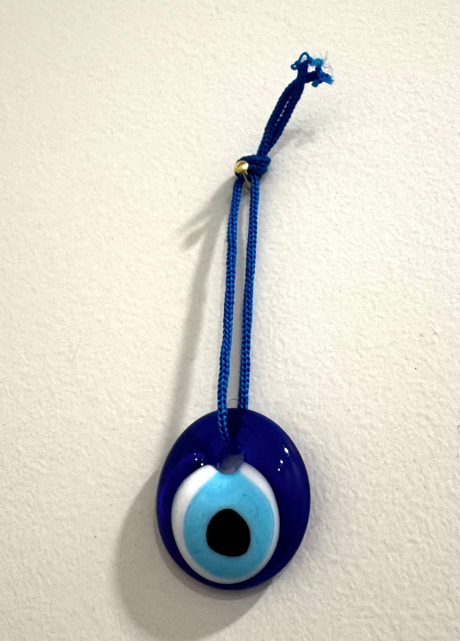 Blue evil eye charm